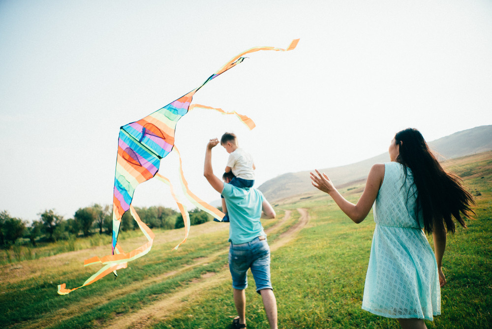 Family flying a kite outside